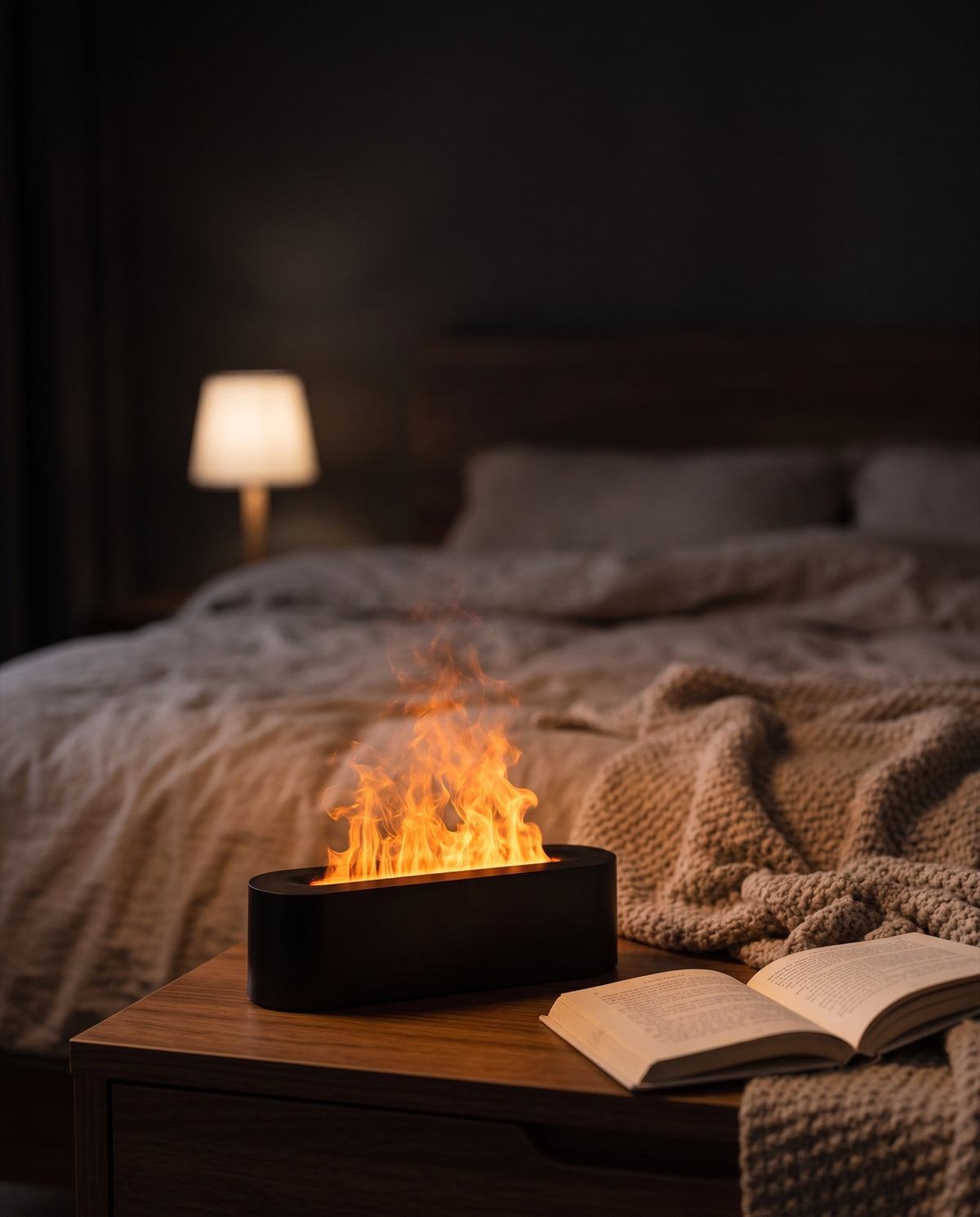 Emberwick flame diffuser glowing orange on a bedside table at night